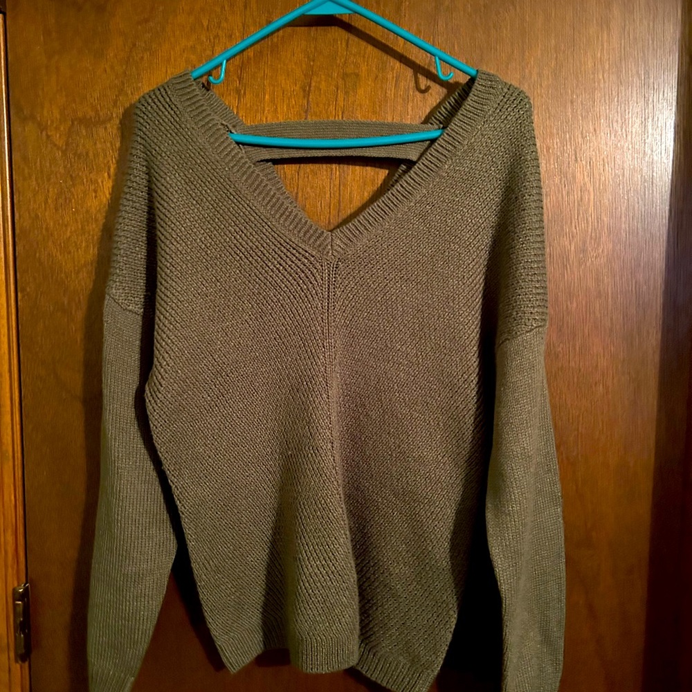 Poof sweater with strap across back. Olive green
